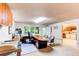 Large home office space with built-in desk, natural light and adjacent kitchen at 8888 W 37Th Pl, Wheat Ridge, CO 80033