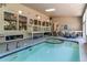 Indoor pool with hot tub, seating and deck that extends out of the window at 8888 W 37Th Pl, Wheat Ridge, CO 80033