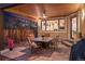 Covered outdoor patio with ceiling fan and stylish furniture, perfect for dining and entertaining at 1156 S Columbine St, Denver, CO 80210