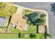 Bird's-eye view of a property highlighting the backyard, deck, and surrounding landscape at 9099 W Harvard Pl, Lakewood, CO 80227