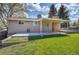 Spacious backyard featuring a covered patio for outdoor entertaining at 9099 W Harvard Pl, Lakewood, CO 80227