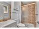 Cozy bathroom featuring a shower with glass doors, a sink, and a toilet with a storage shelf above it at 9099 W Harvard Pl, Lakewood, CO 80227