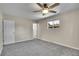 Bedroom featuring neutral walls and gray carpet, bathed in natural light at 9099 W Harvard Pl, Lakewood, CO 80227
