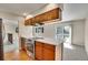 Updated kitchen with hardwood floors, stainless appliances, and quartz countertops at 9099 W Harvard Pl, Lakewood, CO 80227