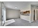 Spacious living room with access to kitchen and sliding glass doors to outdoor area at 9099 W Harvard Pl, Lakewood, CO 80227