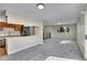 Spacious living room with large windows for plenty of natural light and adjacent eat-in kitchen at 9099 W Harvard Pl, Lakewood, CO 80227