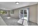 Large living room with natural light and sliding glass door to balcony at 9099 W Harvard Pl, Lakewood, CO 80227