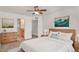 Bright bedroom with a queen bed and ensuite bathroom access at 4849 Halifax Ct, Denver, CO 80249