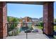 Enjoy city views from this balcony with black metal railing and brick columns at 1823 Grove St, Denver, CO 80204