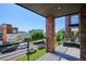 Balcony with brick columns offers views of the city skyline and surrounding neighborhood at 1823 Grove St, Denver, CO 80204