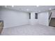 Spacious basement with plush carpeting, and staircase leading up at 1823 Grove St, Denver, CO 80204