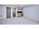 Finished basement features a bar area with black countertops and wood cabinets at 1823 Grove St, Denver, CO 80204