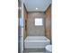 Bright bathroom features tile accent wall and a sleek bathtub, perfect for relaxation at 1823 Grove St, Denver, CO 80204