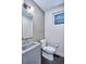 Contemporary powder room featuring a floating sink, modern fixtures, and a sleek, tiled accent wall at 1823 Grove St, Denver, CO 80204