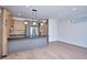 Bright, modern kitchen with gray island, wooden cabinetry, stainless steel appliances, and open floor plan at 1823 Grove St, Denver, CO 80204