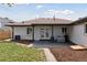 Backyard features a concrete patio, wooden deck, and well-maintained lawn at 3440 N Harrison St, Denver, CO 80205