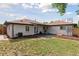 Spacious backyard has a well-maintained lawn and patio, perfect for entertaining at 3440 N Harrison St, Denver, CO 80205