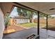 Backyard features a concrete patio with a fire pit and an enclosed privacy fence at 3440 N Harrison St, Denver, CO 80205
