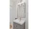 Stylish bathroom vanity features a square sink, sleek mirror, and modern lighting fixtures at 3440 N Harrison St, Denver, CO 80205