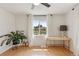Bright bedroom features hardwood floors and a large window overlooking the front yard at 3440 N Harrison St, Denver, CO 80205