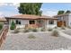 Charming single-story home boasts a well-manicured front yard with xeriscaping and lovely drought-tolerant plants at 3440 N Harrison St, Denver, CO 80205