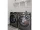 Modern laundry room with front loading washer and dryer at 3440 N Harrison St, Denver, CO 80205