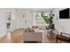 Bright living room features hardwood floors, neutral tones, and lots of natural light at 3440 N Harrison St, Denver, CO 80205
