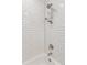 The bathroom shower features clean, white subway tile at 3440 N Harrison St, Denver, CO 80205