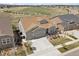 An elevated view of a two-story home with a two-car garage and well-manicured landscaping at 8621 S De Gaulle Ct, Aurora, CO 80016