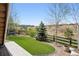 Enjoy a backyard with well maintained turf, shrubbery, and a beautiful view of the neighborhood at 8621 S De Gaulle Ct, Aurora, CO 80016