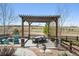 Wonderful backyard area featuring an outdoor dining area under a pergola and outdoor bar; perfect for entertaining at 8621 S De Gaulle Ct, Aurora, CO 80016