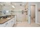 Bathroom featuring glass enclosed shower with tiled walls and floors plus toilet at 8621 S De Gaulle Ct, Aurora, CO 80016