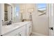 Bathroom featuring double sinks, granite counter tops, and mosaic backsplash at 8621 S De Gaulle Ct, Aurora, CO 80016