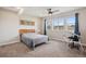 Cozy bedroom with natural light from three windows; great natural light and ceiling fan included at 8621 S De Gaulle Ct, Aurora, CO 80016
