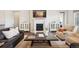Cozy living room with a fireplace, stylish furniture, and tasteful decor at 8621 S De Gaulle Ct, Aurora, CO 80016