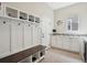 Stylish mudroom with storage for shoes and coats and plenty of countertop space and natural light at 8621 S De Gaulle Ct, Aurora, CO 80016