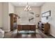 Home office with hardwood floors, wooden desk, and bright window at 8621 S De Gaulle Ct, Aurora, CO 80016
