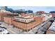 Panoramic aerial view of a brick building with rooftop decks and a vibrant urban setting at 1501 Wazee St # 4B, Denver, CO 80202