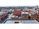 Expansive aerial view showcasing the city skyline and historic brick buildings in a thriving urban neighborhood at 1501 Wazee St # 4B, Denver, CO 80202