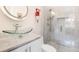 Modern bathroom featuring a glass vessel sink, marble countertops, and a luxurious glass-enclosed shower at 1501 Wazee St # 4B, Denver, CO 80202
