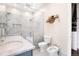 Elegant bathroom showcasing modern fixtures, a marble countertop, and a glass shower enclosure at 1501 Wazee St # 4B, Denver, CO 80202