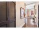 Hallway with hardwood floors, closet and wall art, leading into a bright living space at 1501 Wazee St # 4B, Denver, CO 80202