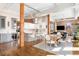 Open-concept kitchen with an island, modern appliances, and adjacent dining area at 1501 Wazee St # 4B, Denver, CO 80202
