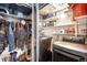 Functional laundry room with washer, dryer, shelving, and storage, efficiently designed for convenience at 1501 Wazee St # 4B, Denver, CO 80202