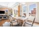 Bright and open living room featuring a dining area with access to an outdoor patio at 1501 Wazee St # 4B, Denver, CO 80202
