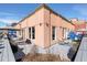 Stunning outdoor patio with chic seating areas, grey deck, potted plants, and colorful privacy screens at 1501 Wazee St # 4B, Denver, CO 80202