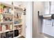 Well-organized pantry with ample shelving, modern refrigerator with water dispenser, and convenient storage solutions at 1501 Wazee St # 4B, Denver, CO 80202