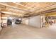 Large indoor parking garage with concrete flooring and walls, featuring parked vehicles at 1501 Wazee St # 4B, Denver, CO 80202