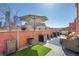 Relax on this rooftop patio with comfortable seating, lush plants, and city views, perfect for entertaining at 1501 Wazee St # 4B, Denver, CO 80202