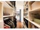 Spacious walk-in closet with custom shelving offering ample storage space and organization at 1501 Wazee St # 4B, Denver, CO 80202